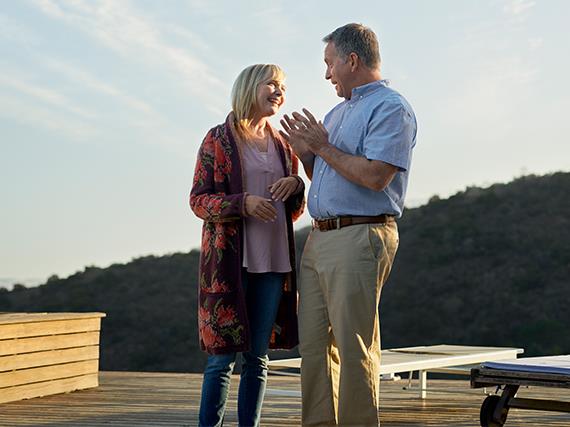 Happy couple talking about Beltone Amaze wireless hearing aids