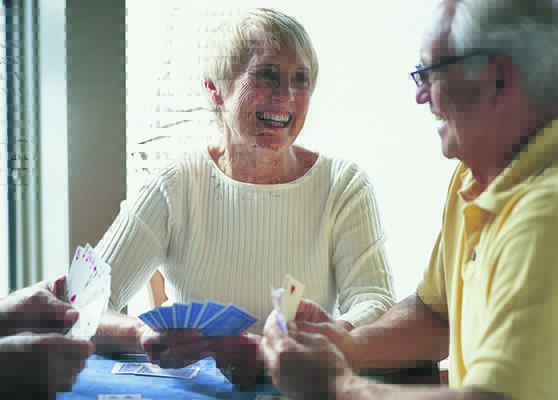 Elderly people playing a card game