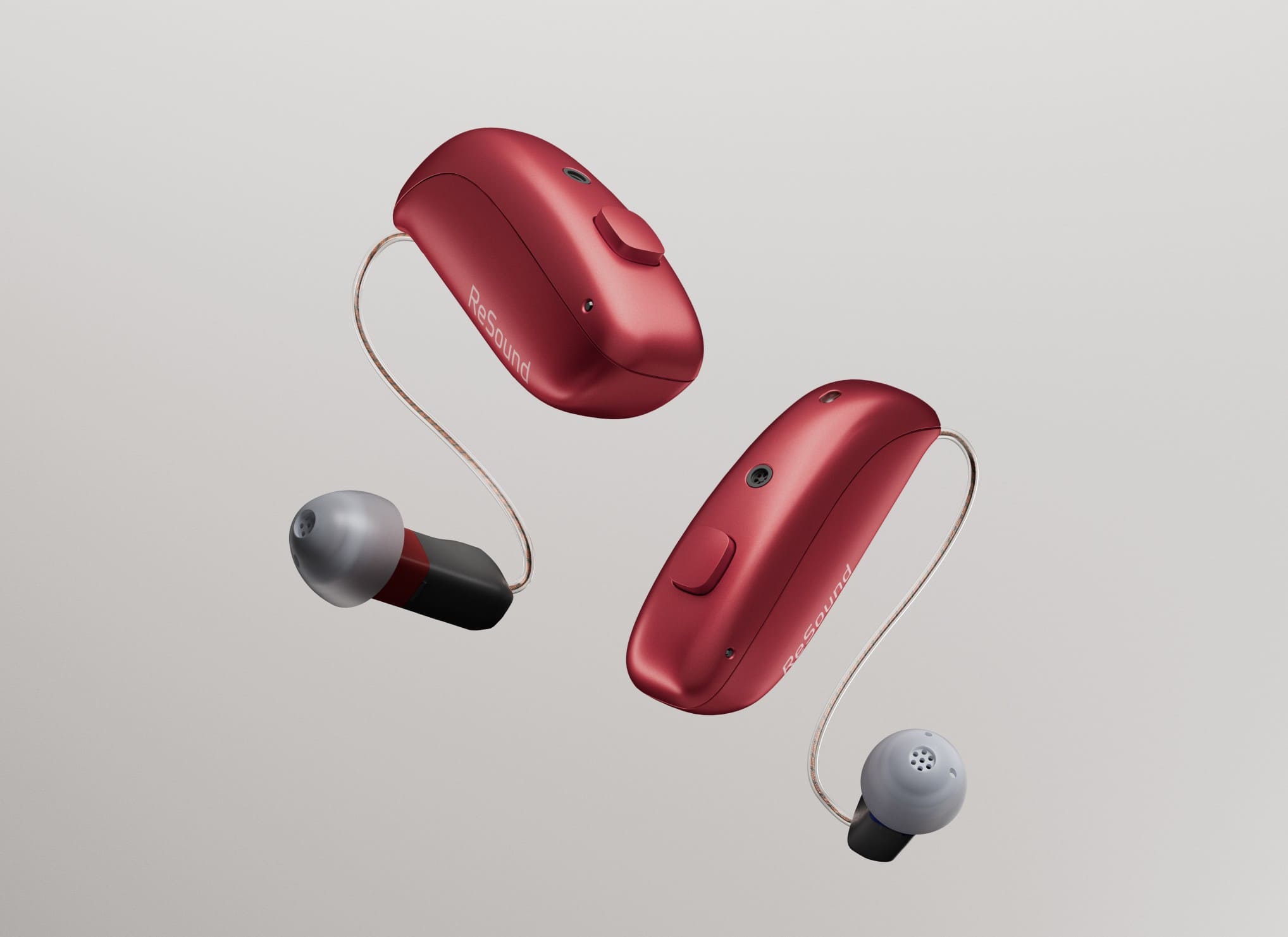 Red ReSound Vivia floating against Gray Backdrop